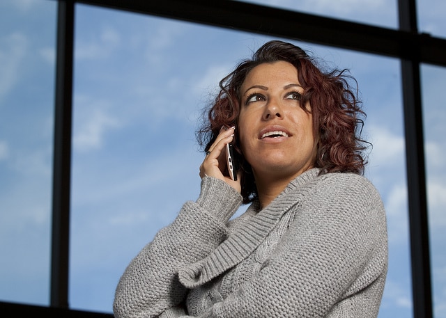 Business Woman on Cell Phone. Photograph by Randy Kashka, used under Attribution License http://www.flickr.com/photos/randykashka/